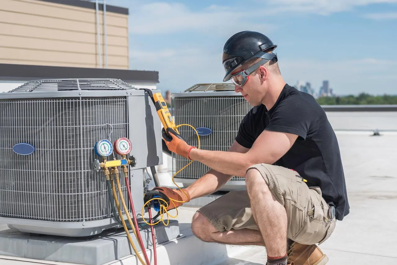 Technician installing a new energy-efficient air conditioning unit in a Bay Area home